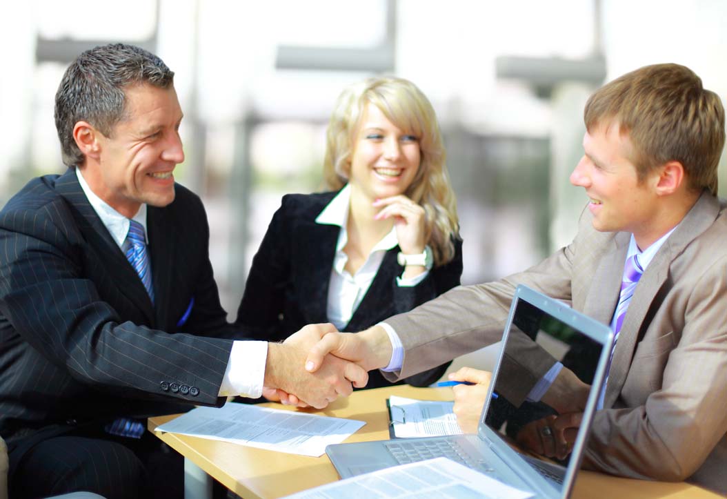 Business people shaking hands, finishing up a meeting 2017